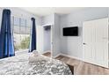 Bright bedroom with a queen bed and large window at 3175 Feltrim Pl # 305, Kissimmee, FL 34747
