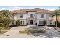 Luxury home with a tile roof and driveway at 1261 Radiant St, Reunion, FL 34747