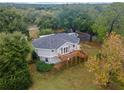 Elevated circular home with deck and large lot, nestled among trees at 1399 Old Mount Dora Rd, Eustis, FL 32726