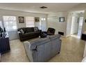 Bright living room featuring neutral tones, comfortable seating, and natural light at 1456 N Page Dr, Deltona, FL 32725