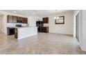 Open concept kitchen with island and breakfast bar at 273 St Georges Cir, Eagle Lake, FL 33839