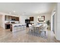 Modern kitchen with island, stainless steel appliances, and breakfast bar at 273 St Georges Cir, Eagle Lake, FL 33839