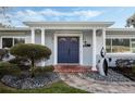 Home with a blue front door and brick walkway at 604 Endsley Ave, Altamonte Springs, FL 32701