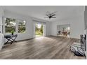 Open living room with sliding doors leading to backyard at 6424 Sleepy Hollow Dr, Orlando, FL 32810