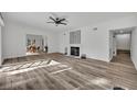 Spacious living room featuring hardwood floors and a fireplace at 6424 Sleepy Hollow Dr, Orlando, FL 32810
