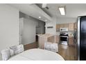 Eat-in kitchen with stainless steel appliances and light wood cabinets at 843 Challenger Ave, Davenport, FL 33897