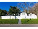 Front view of charming house with white fence at 1202 Dewey Ave, Orlando, FL 32808