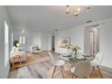 Bright, open-concept living and dining area with modern furnishings and abundant natural light at 12755 Oulton Cir, Orlando, FL 32832