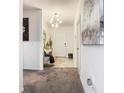 Spacious entryway with light walls and a chandelier at 208 Goldenrod Ln, Kissimmee, FL 34759