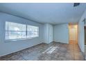 Bright living room with tile floors and large windows at 209 Meadow Hills Dr, Sanford, FL 32773