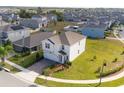 Two-story house with driveway, nestled in a community of homes at 2910 Black Birch Dr, Ocoee, FL 34761