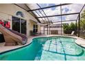 Relaxing screened-in pool area with a fun water slide, perfect for enjoying the outdoors in privacy at 3022 Bransbury Ct, Kissimmee, FL 34747