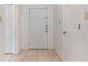 Simple entryway with white door and tile floor at 4392 S Lake Orlando Pkwy # 4, Orlando, FL 32808