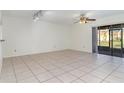 Living room with tile floors and sliding glass doors at 4392 S Lake Orlando Pkwy # 4, Orlando, FL 32808