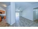 Open-concept living room with tile floors and a view of the kitchen at 637 Twin Lake Ave, Deltona, FL 32738