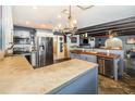 Modern kitchen with stainless steel appliances and concrete countertops at 1265 Lake Francis Dr, Apopka, FL 32712
