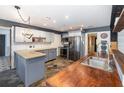 Updated kitchen featuring gray cabinets, concrete and wood countertops at 1265 Lake Francis Dr, Apopka, FL 32712