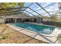 Inviting screened pool with patio and pebble tec decking at 1265 Lake Francis Dr, Apopka, FL 32712