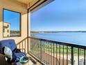 Relaxing balcony with lake view and seating at 16300 County Road 455 # 610, Montverde, FL 34756
