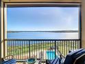 Stunning balcony view overlooking lake, pool, and landscape at 16300 County Road 455 # 610, Montverde, FL 34756
