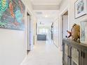 Bright hallway with tile floors, leading to living area at 16300 County Road 455 # 610, Montverde, FL 34756