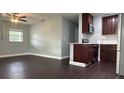 Modern kitchen with dark brown cabinets, stainless steel appliances, and light countertops at 3017 Touraine Ave, Orlando, FL 32812