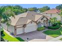 Single-story house with a large backyard and a two-car garage at 3039 Zaharias Dr, Orlando, FL 32837