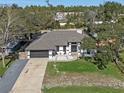 Housetop view of a single-Gathering home with a spacious yard and driveway at 542 N Firwood Dr, Deltona, FL 32725