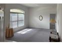Inviting living area with ample natural light and neutral tones for versatile decorating at 1161 Roxboro Rd, Longwood, FL 32750