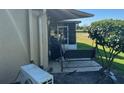 Backyard view of an AC unit and patio area at 1641 Lake Marion Dr, Apopka, FL 32712