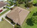 Aerial view of a home with a well-maintained roof, manicured landscaping, and a private backyard setting at 218 Black Springs Ln, Winter Garden, FL 34787