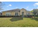 One-story house with a green door and well-maintained lawn at 218 Black Springs Ln, Winter Garden, FL 34787