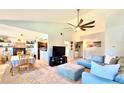 Open concept living area showcasing a comfortable sectional sofa and dining table at 5271 Whitstable Way # 1, Orlando, FL 32812