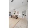 Bright dining room with light wood floors and a modern table at 632 Kermarah Ave, Haines City, FL 33844