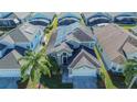 House with solar panels, showcasing its location in a residential neighborhood at 8059 King Palm Cir, Kissimmee, FL 34747