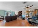 Spacious living area featuring hardwood floors and built-in shelving at 1326 Evangeline Ave, Orlando, FL 32809