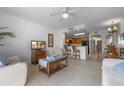 Open concept living room with kitchen and dining area at 13427 Blue Heron Beach Dr # 106, Orlando, FL 32821