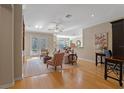 Spacious living room with hardwood floors and access to a patio at 1592 Lincolnshire Drive, Deland, FL 32724