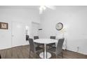 Bright dining area with a round table and four gray chairs at 3900 Southpointe Dr # 127, Orlando, FL 32822