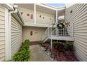 Condo building exterior showcasing landscaping and a stairway at 3900 Southpointe Dr # 127, Orlando, FL 32822