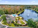 Aerial view of community pool, clubhouse, and lake at 412 Summit Ridge Pl # 210, Longwood, FL 32779