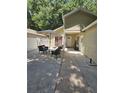 Outdoor patio area with seating, umbrella, and welcoming ambiance at 513 Harvard Pl, Apopka, FL 32703