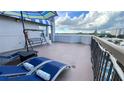 Outdoor balcony with lounge chairs and city views at 6165 Carrier Dr # 3707, Orlando, FL 32819
