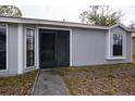 Gray house with a walkway leading to the front entrance at 741 Caribou Dr, Kissimmee, FL 34759