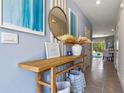 Entryway with console table, mirror, and a view into the dining area at 2191 Longleaf Rd, Davenport, FL 33837