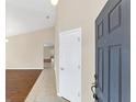 Bright entryway with wood floors and neutral walls at 5813 Great Egret Dr, Sanford, FL 32773