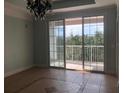 Bright dining room with access to a private balcony at 6413 Astor Village Ave # 314, Orlando, FL 32835
