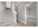 Bright and airy carpeted staircase leading to the upper level at 7749 Sweet Star Ave, Orlando, FL 32836