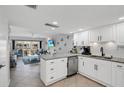 Modern kitchen with granite countertops and stainless steel appliances at 111 N Atlantic Ave # 2090, New Smyrna Beach, FL 32169
