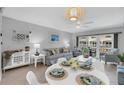 Relaxing living room with comfortable seating and access to balcony at 111 N Atlantic Ave # 2090, New Smyrna Beach, FL 32169